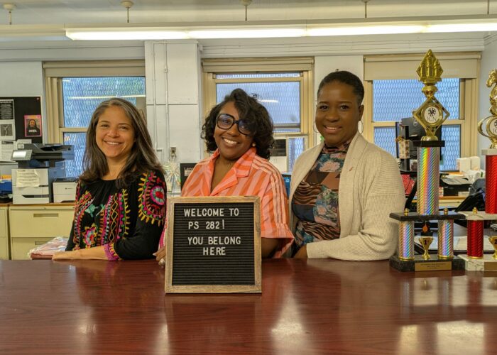 PS 282 Staff at the front desk, left to right: Ms. Ramos (Procurement), Ms. Brissett (Secretary), and Ms. Campbell (Assistant Principal, lower grades)