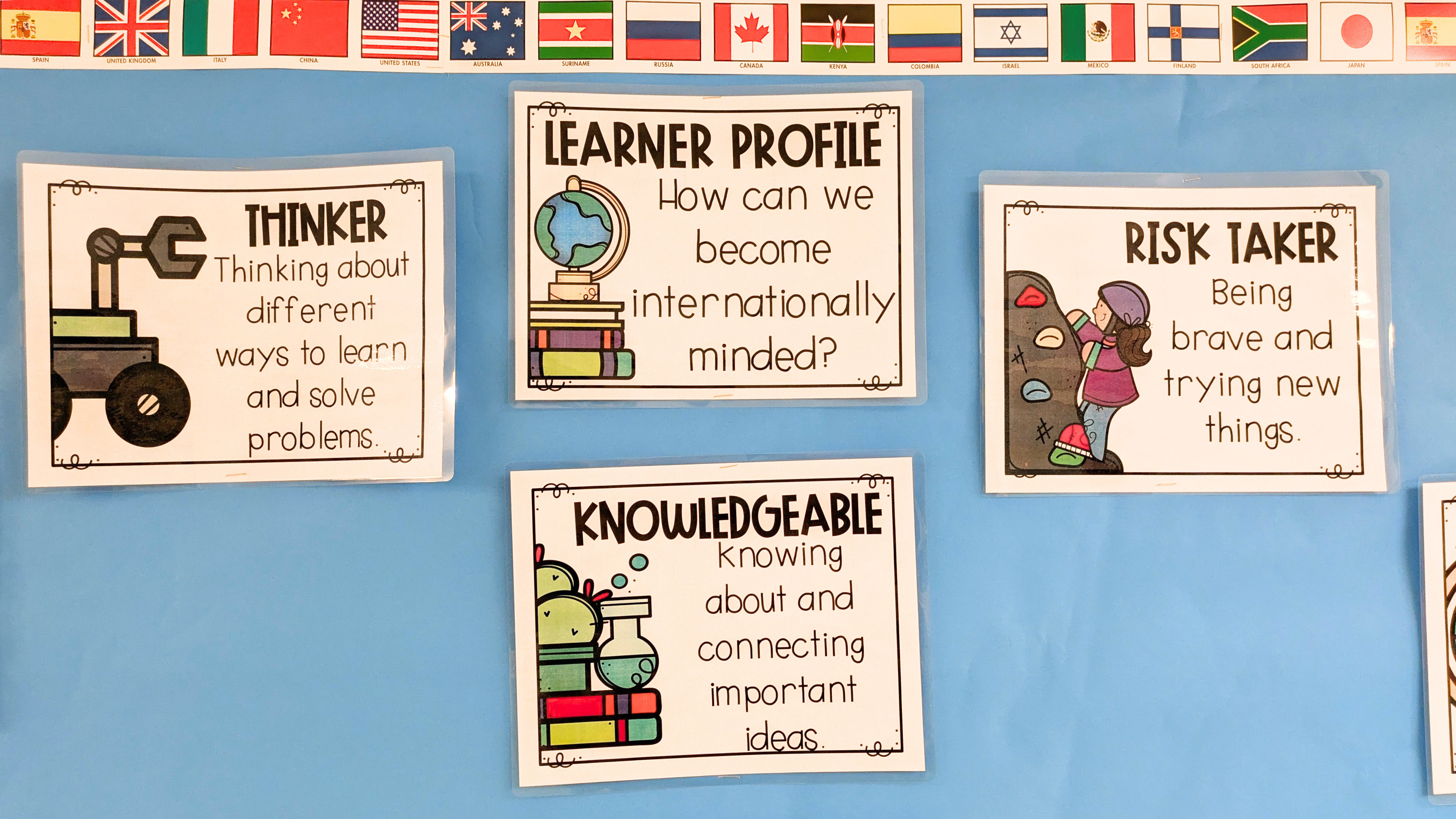 Bulletin board with IB learner profiles, including thinker, knowledgeable, and risk taker